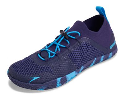 Speedo USA  Unisex Women's Fathom AQ Water Shoes Footwear : Navy/Blue: Fathom the possibilities. High-intensity aquatic workouts calls for a performance training shoe. This minimalist pair features lightweight knit construction that molds to the foot for a barefoot feel. Drainage technology ensures less water absorption and quicker drying time  while superior rubber traction keeps you grounded in and out of the pool.